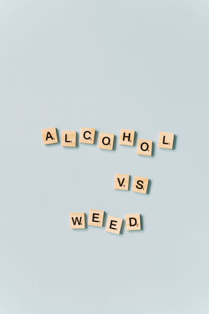 Scrabble tiles spelling 'vs' on a light blue background.